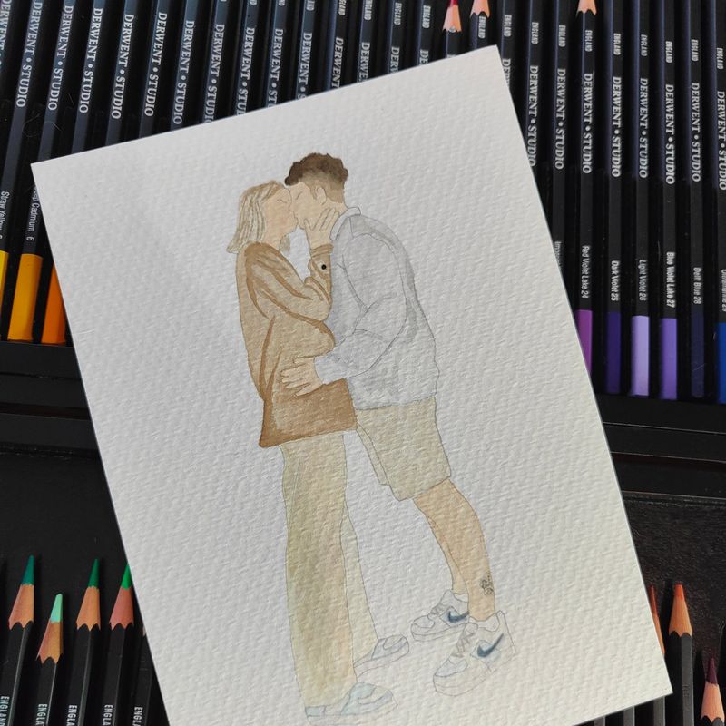 Retrat en aquarel·la d'una parella fent-se un petó